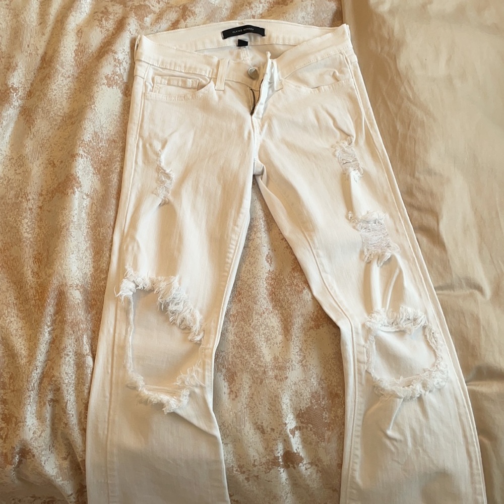 White ripped flare jeans